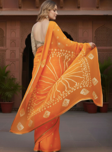 Woman wearing an orange saree with white patterns in a traditional setting