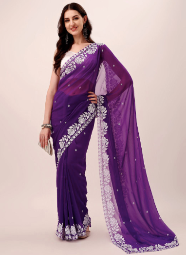 Woman wearing a purple saree with white embroidery on a beige background