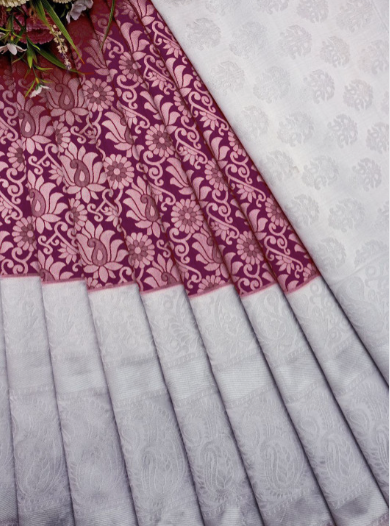 Saree with pink and white floral pattern on a white background