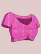Pink and orange plaid top on a beige background
