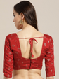 Red blouse with open back design on a neutral background