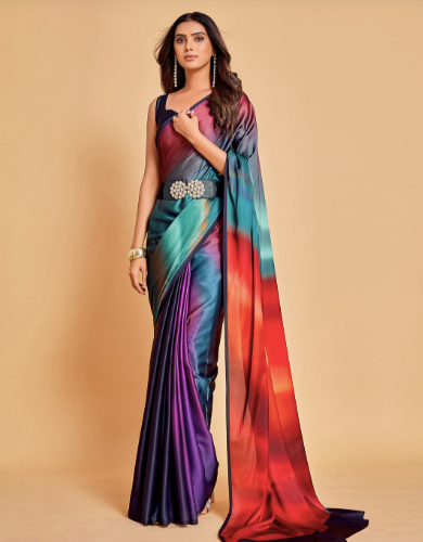 Woman wearing a colorful saree with a gradient design on a beige background