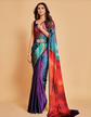 Woman wearing a colorful saree with a gradient design on a beige background