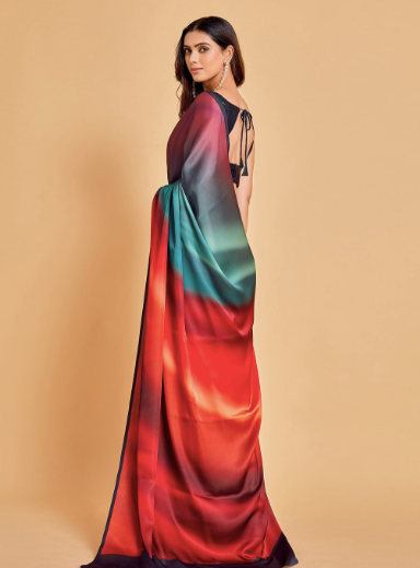 Woman wearing a colorful saree with a gradient design on a beige background