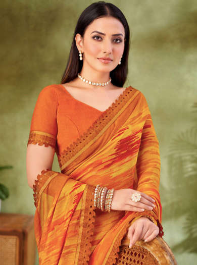 Woman wearing an orange saree with a green background