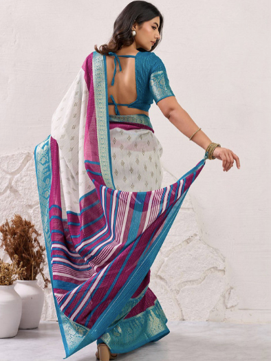 Woman wearing a colorful saree with a white background