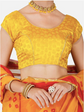 Yellow blouse with red saree and jewelry on a white background